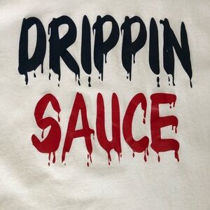 Drippin Sauce lettering graphic on a Luxe-t brand white t-shirt.